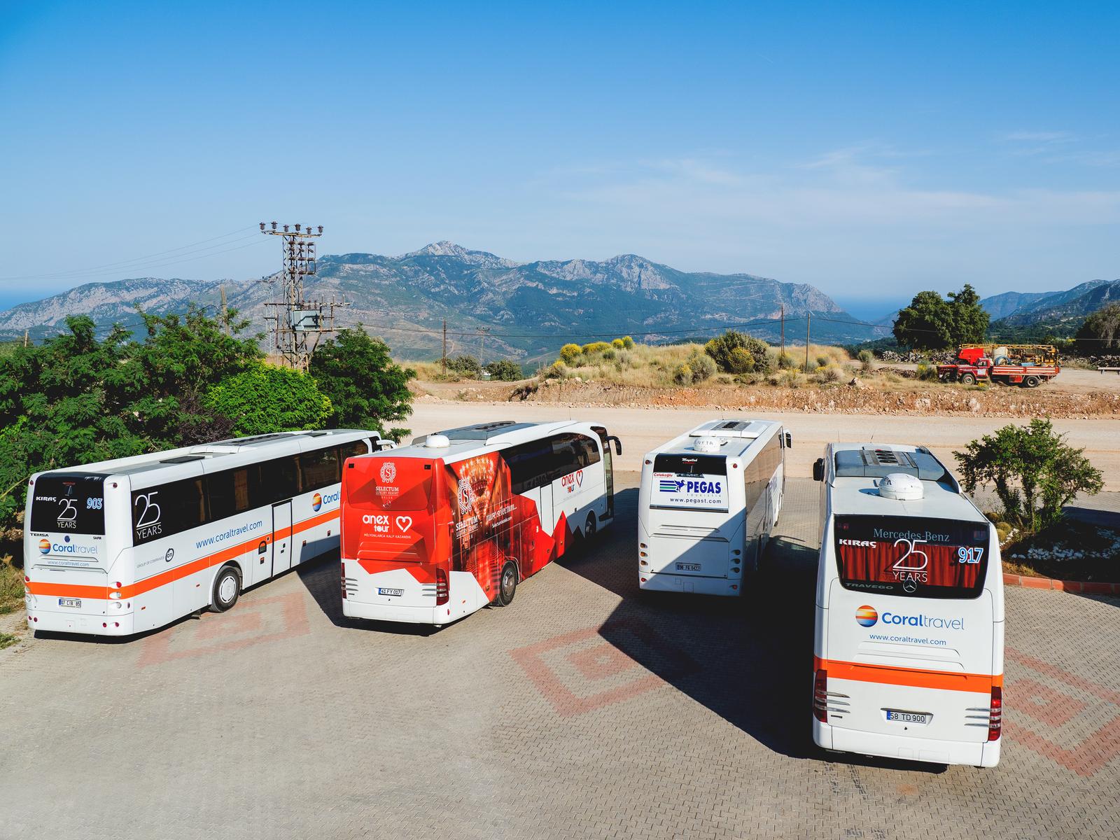 KEMER, TURKEY - May 16, 2018. Touristic buses on parking. Coral travel, Anex tour, Pegas travel agency's transport for tourist excursions.